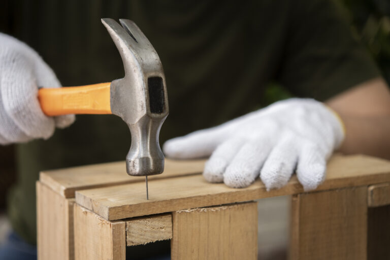 side-view-hand-holding-hammer